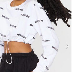 PRETTYLITTLETHING WHITE PRINTED OVERSIZED CROP